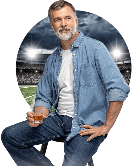 middle aged guy sitting holding a drink